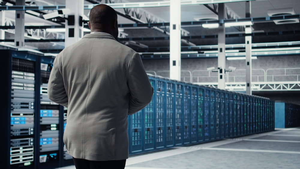 Admin,Walking,In,Data,Center,,Doing,Inspection,On,Infrastructure,Tech